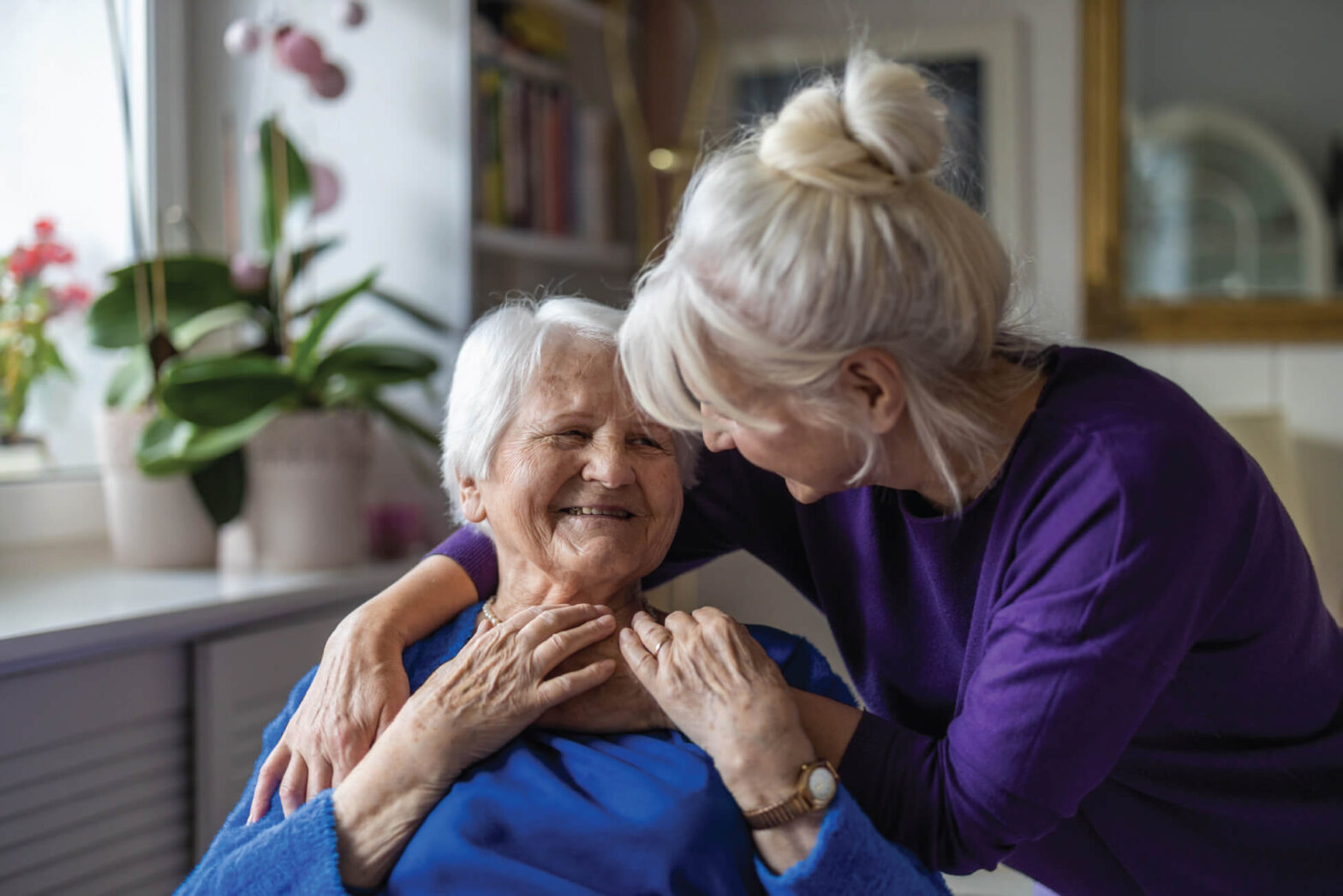 Senior woman getting a hug