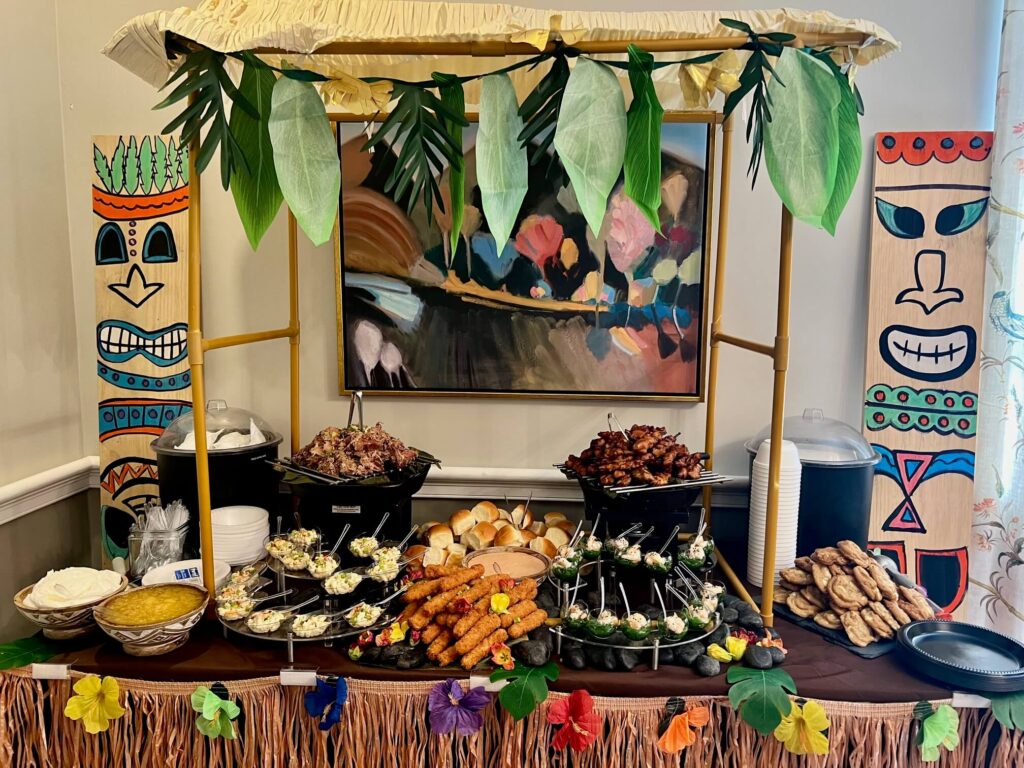 Table of festive Hawaiian food, decorated for a Luau Party