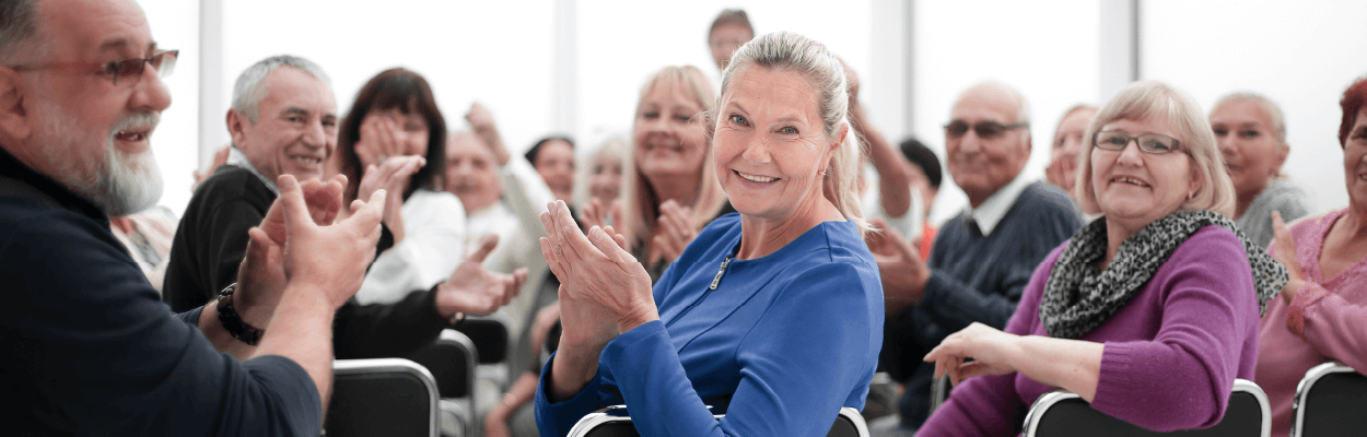 Senior friends gather and applause for a party